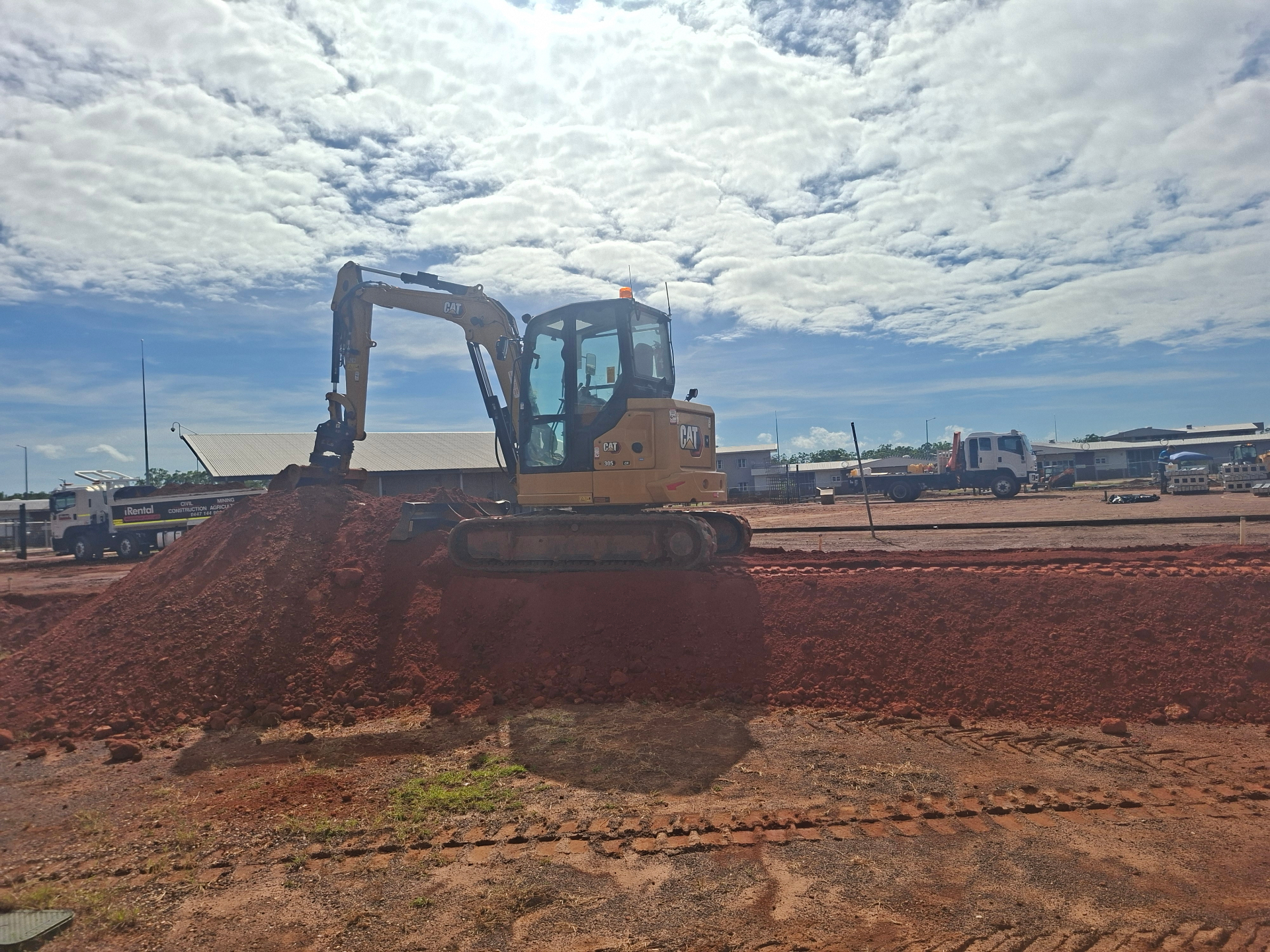 CAT 305 mini excavator on red dirt at the Galltan Civil Training yard in Darwin