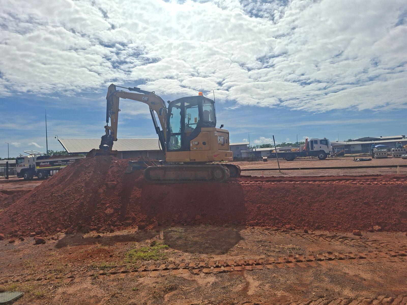 Real Galltan Civil Training excavator on red dirt during practical machine training in Darwin