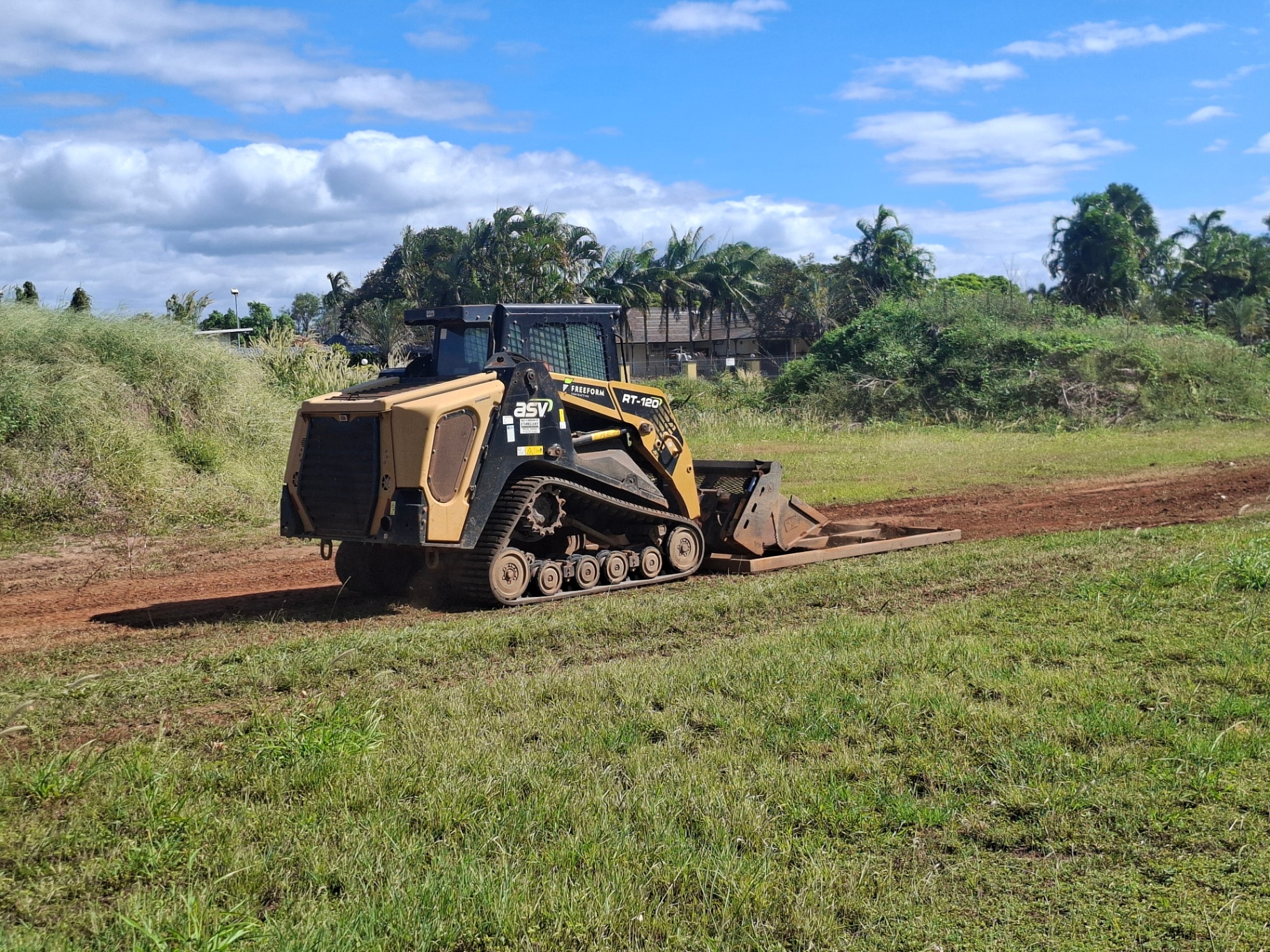 ASV RT-120 tracked skid steer with bucket attachment during operator training in the Top End